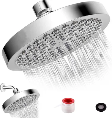 A shower head with water spraying from it, along with a smaller shower head and some accessories.