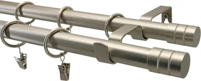 A close-up, angled view of a double curtain rod set with rings and clips, against a white background.