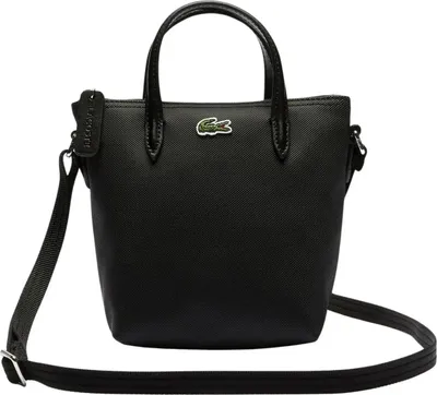 A black Lacoste handbag with a shoulder strap and handles, shown against a white background.