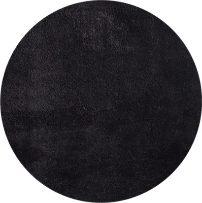 A black circular rug shown from a top-down perspective.