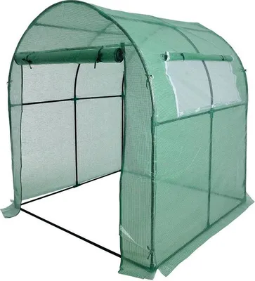 A green arched greenhouse with a metal frame, shown from the front with the entrance open.