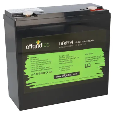 A black battery with a green label showing product information.