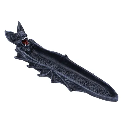 Dieses Objekt ist ein Räucherkegelhalter in Form einer Fledermaus.