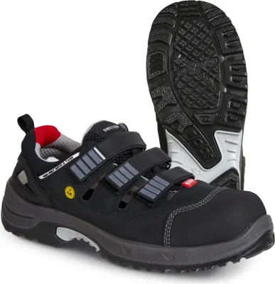 A pair of black safety sandals shown from a side-angle, with one sandal standing upright and the other lying on its sole.