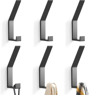 Six black metal wall hooks arranged in two rows of three.
