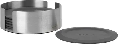 A set of coasters in a holder and one coaster placed next to it.