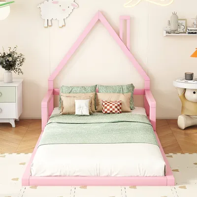 A child's bedroom with a pink house-shaped bed.