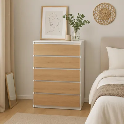 A bedroom scene with a dresser and a bed.