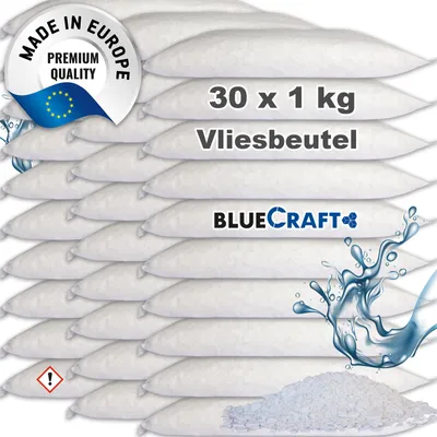 A stack of white, soft bags filled with granular material, arranged in rows.