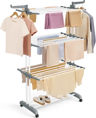 A multi-tiered drying rack with various clothing and towels.