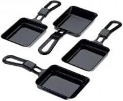 Four black raclette pans are arranged on a white background.
