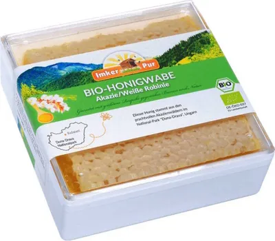 A package of honeycomb honey with a landscape image on the label.