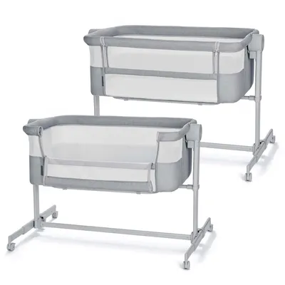 Two baby cribs are shown side-by-side against a white background.