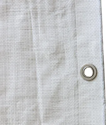 A close-up view of a white tarp with a grommet.