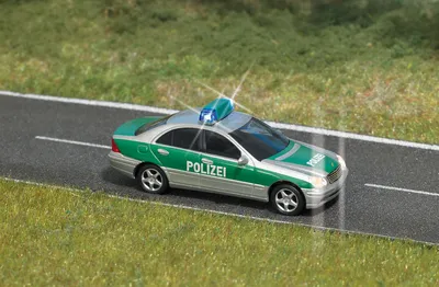 Produktbild von Busch H0 5630 Polizei Mercedes C-Klasse mit Beleuchtung - NEU