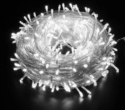 A coiled string of white LED lights against a black background.