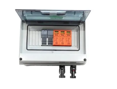 A solar junction box with internal components, shown with its lid open.