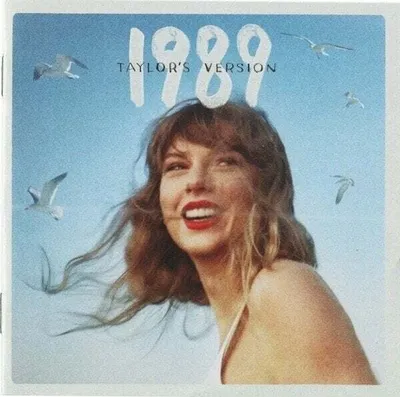 Taylor Swift is shown smiling with seagulls flying around her against a bright blue sky.