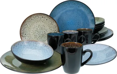 A collection of stoneware dinnerware, including plates, bowls, and mugs, arranged against a white background.