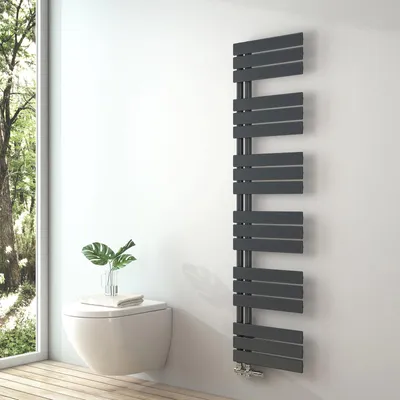 A modern bathroom with a wall-mounted toilet and a stylish anthracite towel radiator.