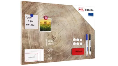 A metallic magnetic board with a wood grain pattern, featuring attached notes, photos, magnets, markers, and a sponge.