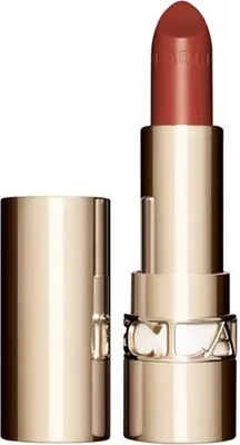 A close-up studio shot of a Clarins Joli Rouge Lipstick in a gold case, with the cap off and the lipstick bullet exposed.