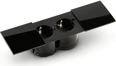 A black double electrical socket with protective covers.