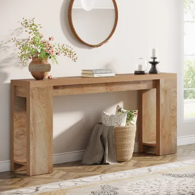 A wooden console table with decorative items in a room.
