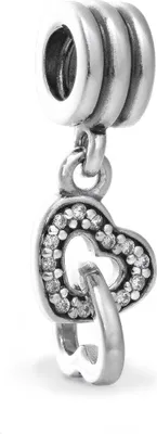 A close-up studio shot of a silver Pandora charm with two intertwined hearts, one encrusted with small clear stones.