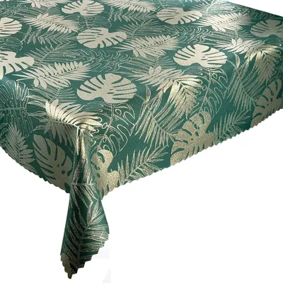 A close-up view of a tablecloth with a monstera leaf pattern.