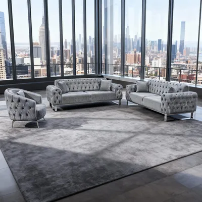 A modern living room with a large window overlooking a city skyline, featuring a grey sofa set.