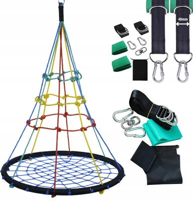 A colorful children's swing set with various accessories laid out.