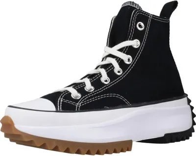 A black Converse Run Star Hike Jwa sneaker with a white sole and laces, and a brown rubber sole.