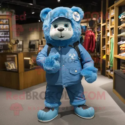 Produktbild von Blauer REDBROKOLY Bär als Maskottchen kostüm gekleidet in einen Parka und Fußkettchen