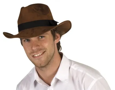 A man wearing a brown cowboy hat and a white shirt.
