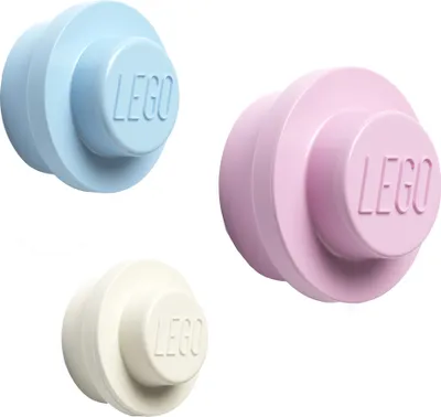 Three LEGO coat hooks in different pastel colors.