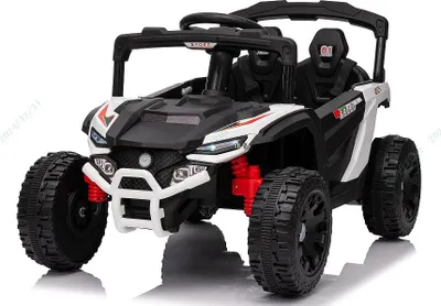 A white and black electric ride-on car for children.