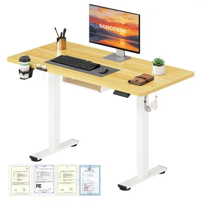 A standing desk with a computer monitor, keyboard, mouse, and accessories.