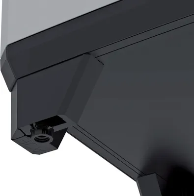 A close-up view of the bottom corner of a dark gray storage cabinet, showing a hexagonal fitting with a threaded screw.