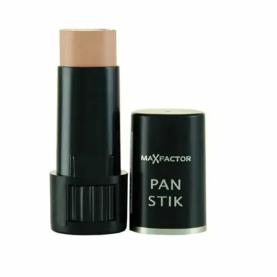 A Max Factor Pan Stick makeup product is shown against a white background. The cap is off and placed next to the stick.
