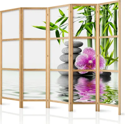 A room divider with a Japanese-inspired design featuring bamboo, orchids, and stacked stones.
