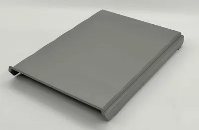 A gray lid for a trash can is shown on a light gray background.