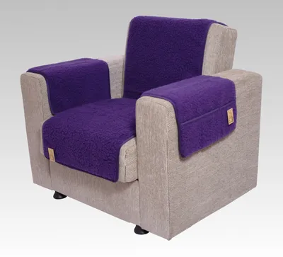A purple chair cover set on a tan armchair.