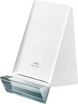 A white wireless charger stand with a clear glass base.