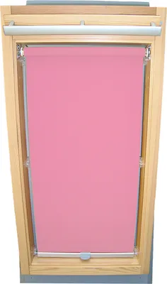 A pink roller blind installed in a wooden framed skylight.