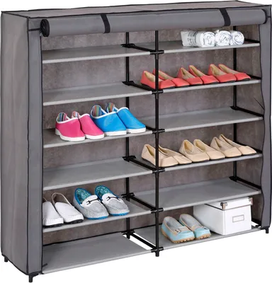 A multi-tiered shoe rack filled with shoes and a box.