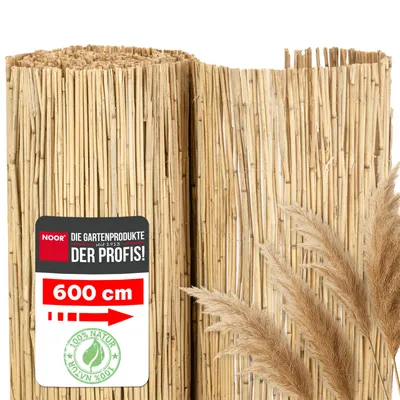 A rolled-up reed mat, likely for garden use, with a promotional label attached.