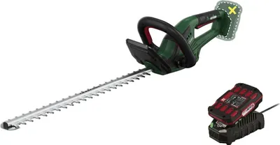 A cordless hedge trimmer with a battery and charger, displayed on a white background.