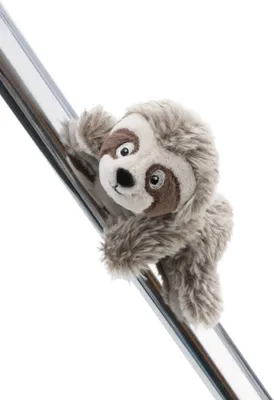 A plush sloth toy is hanging from a metal pole.