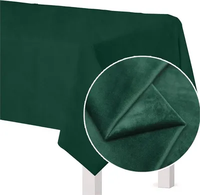 A dark green tablecloth draped over a table, with a close-up inset showing the fabric texture.